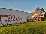 Mural - Graffiti - Pintada - "Mural por los 82 años de Santa Fe en el estadio de la universidad nacional por la UNAL Albi-roja" Mural de la Barra: La Guardia Albi Roja Sur • Club: Independiente Santa Fe